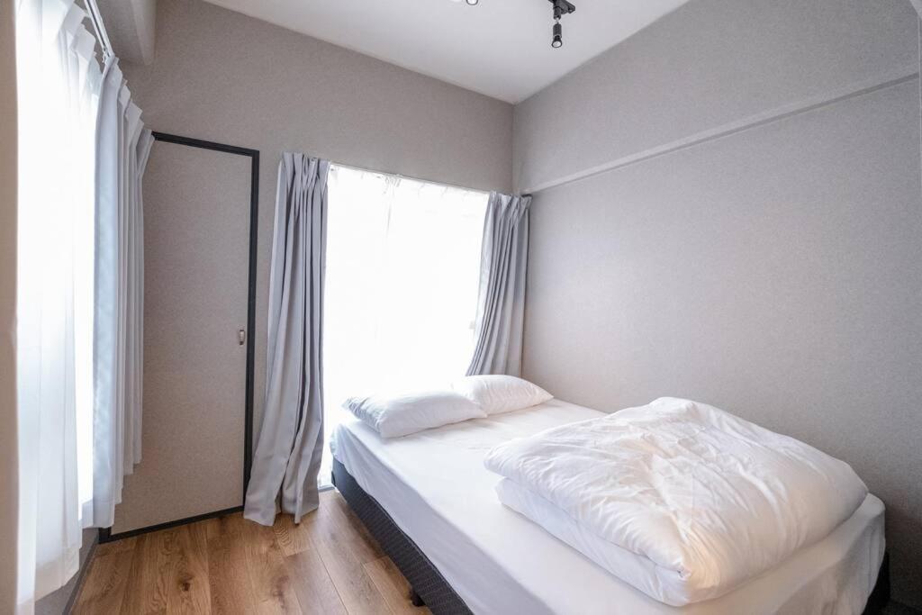 Apartment Tasoneurbanstayosaka なんば日本橋南不夜城703 *